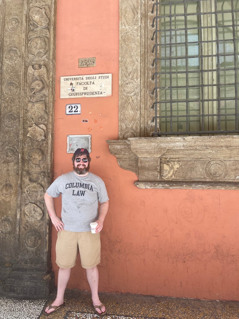 The author standing beside the street number of the University of Bologna’s Jurisprudence Faculty.
